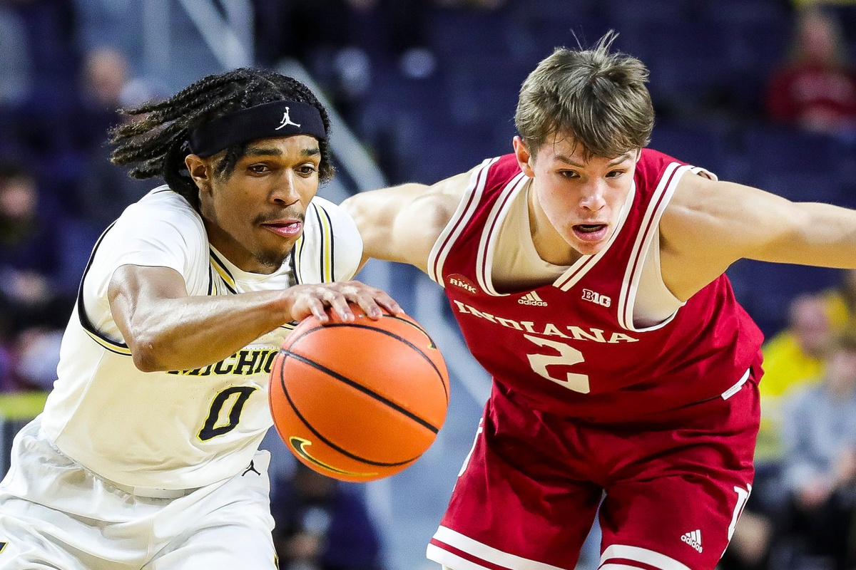 Michigan guard Dug McDaniel dribbles against Indiana guard Gabe Cupps during the first half at Crisler Center in Ann Arbor on Tuesday, Dec. 5, 2023.